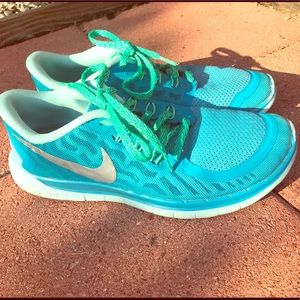 Teal Nike free runs